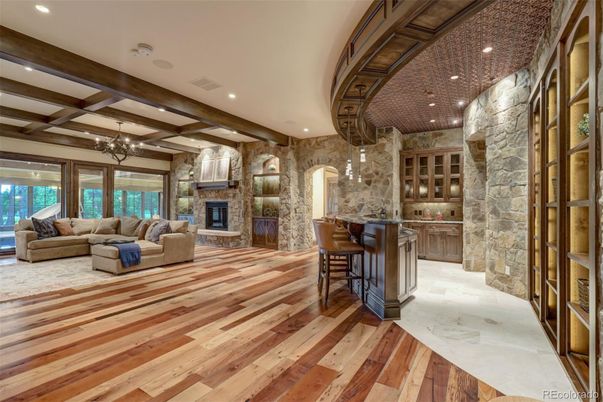 Chandelier, Fireplace, Interior, Living room, Recessed Lighting, Stone Walls, Wooden Beams, Wood Texture Flooring