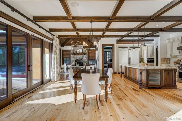 Dining room, Fireplace, Interior, Kitchen, Pendant Lights, Recessed Lighting, Stainless Steel Appliances, Stone Walls, Wooden Beams, Wood Texture Flooring