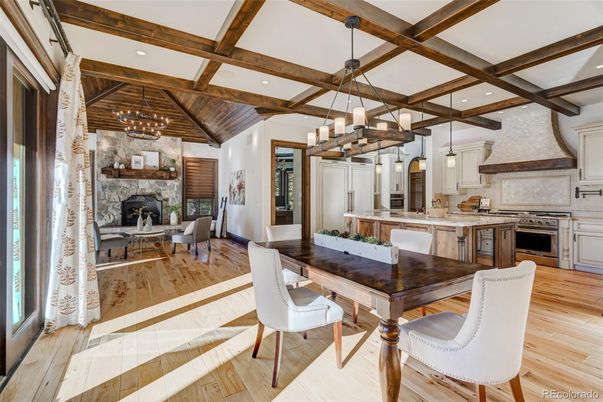 Chandelier, Dining room, Fireplace, Interior, Kitchen, Pendant Lights, Recessed Lighting, Stainless Steel Appliances, Wooden Beams, Wood Texture Flooring