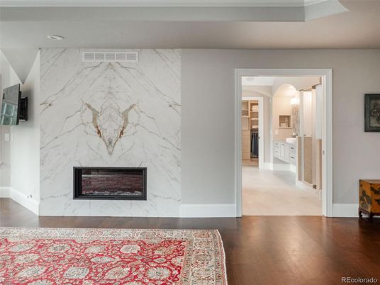 Fireplace, Interior, Marble Walls, Recessed Lighting, Wood Texture Flooring