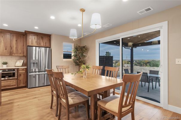 Dining room, Interior, Kitchen, Pendant Lights, Recessed Lighting, Stainless Steel Appliances, Wood Texture Flooring