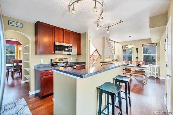 Dining room, Interior, Kitchen, Pendant Lights, Stainless Steel Appliances, Wood Texture Flooring