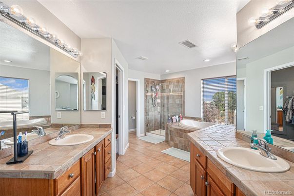 Bathroom, Dual Sink Vanities, Glass Shower, Interior, Recessed Lighting, Tile Countertops