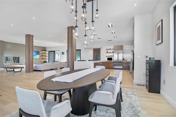 Dining room, Fireplace, Interior, Kitchen, Living room, Pendant Lights, Recessed Lighting, Stainless Steel Appliances, Wood Texture Flooring
