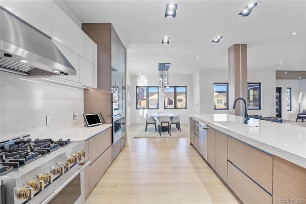 Dining room, Interior, Kitchen, Pendant Lights, Recessed Lighting, Stainless Steel Appliances, Wood Texture Flooring