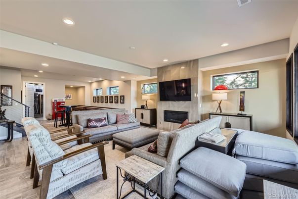 Billiard Table, Fireplace, Game Room, Interior, Living room, Piano, Recessed Lighting, Wood Texture Flooring