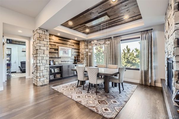 Dining room, Fireplace, Interior, Pendant Lights, Recessed Lighting, Stone Walls, Wood Texture Flooring