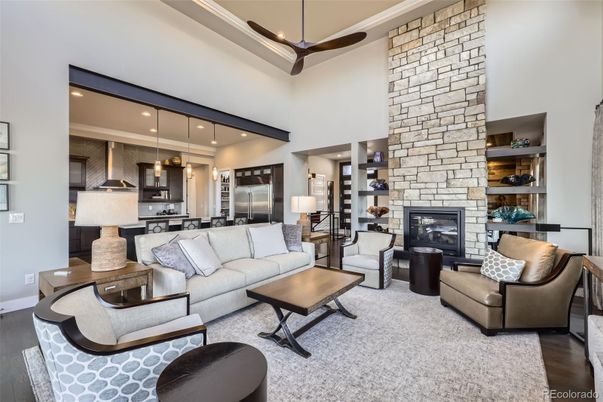 Fireplace, Interior, Kitchen, Living room, Pendant Lights, Recessed Lighting, Stainless Steel Appliances, Stone Walls, Wood Texture Flooring