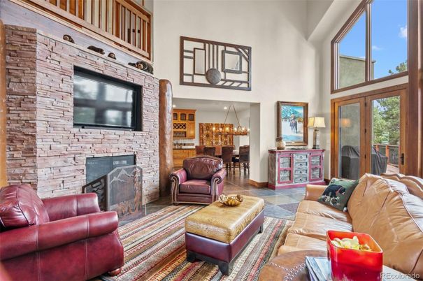 Chandelier, Fireplace, Interior, Living room, Stone Walls