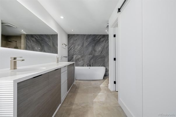 Bathroom, Dual Sink Vanities, Free Standing Baths, Interior, Marble Walls, Recessed Lighting