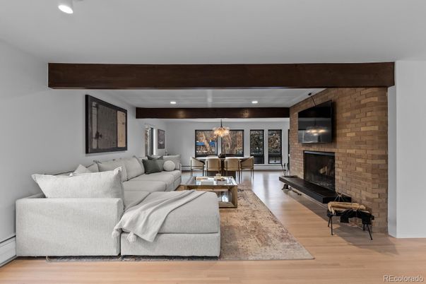 Dining room, Fireplace, Interior, Living room, Pendant Lights, Recessed Lighting, Stone Walls, Wood Texture Flooring