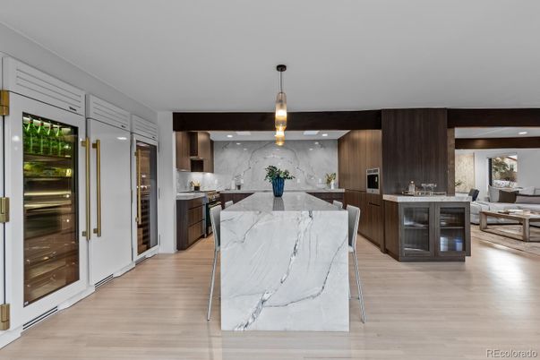 Interior, Kitchen, Marble Walls, Pendant Lights, Recessed Lighting, Stainless Steel Appliances, Wood Texture Flooring