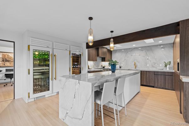 Interior, Kitchen, Marble Walls, Pendant Lights, Recessed Lighting, Stainless Steel Appliances, Wood Texture Flooring