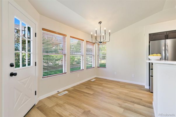 Empty room, Interior, Kitchen, Pendant Lights, Stainless Steel Appliances, Wood Texture Flooring
