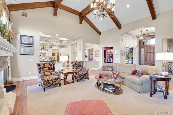 Chandelier, Fireplace, Interior, Living room, Pendant Lights, Recessed Lighting, Wooden Beams, Wood Texture Flooring