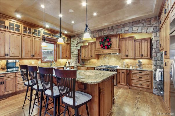 Interior, Kitchen, Pendant Lights, Recessed Lighting, Stainless Steel Appliances, Stone Walls, Wood Texture Flooring