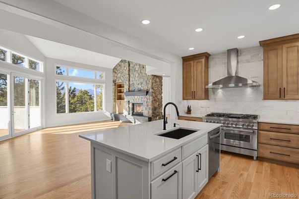Fireplace, Interior, Kitchen, Recessed Lighting, Stainless Steel Appliances, Stone Walls, Wood Texture Flooring