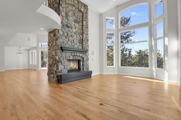 Empty room, Fireplace, Interior, Recessed Lighting, Stone Walls, Wood Texture Flooring