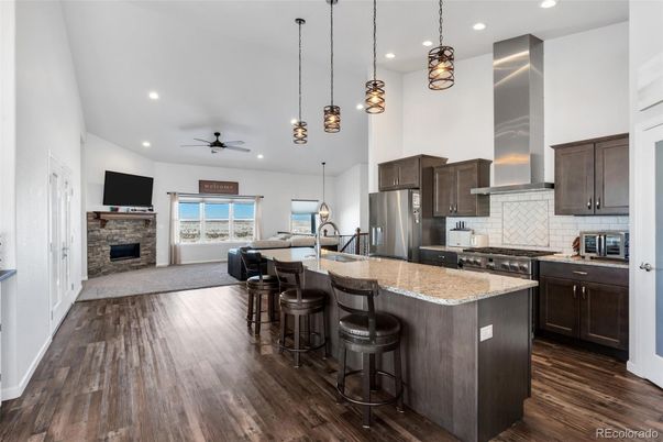Fireplace, Interior, Kitchen, Pendant Lights, Recessed Lighting, Stainless Steel Appliances, Wood Texture Flooring
