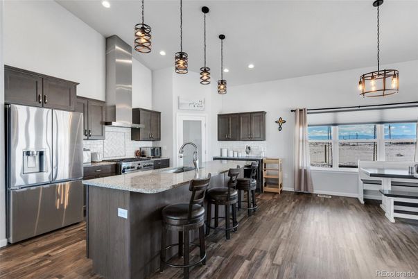 Dining room, Interior, Kitchen, Pendant Lights, Recessed Lighting, Stainless Steel Appliances, Wood Texture Flooring