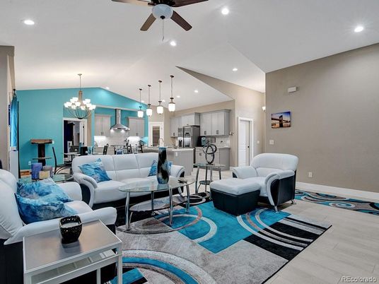 Chandelier, Dining room, Interior, Kitchen, Living room, Pendant Lights, Recessed Lighting, Stainless Steel Appliances, Wood Texture Flooring