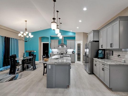 Chandelier, Dining room, Interior, Kitchen, Pendant Lights, Recessed Lighting, Stainless Steel Appliances, Wood Texture Flooring