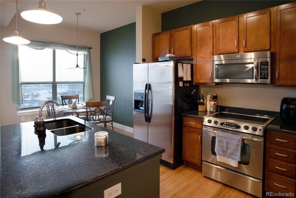 Dining room, Interior, Kitchen, Pendant Lights, Stainless Steel Appliances, Wood Texture Flooring