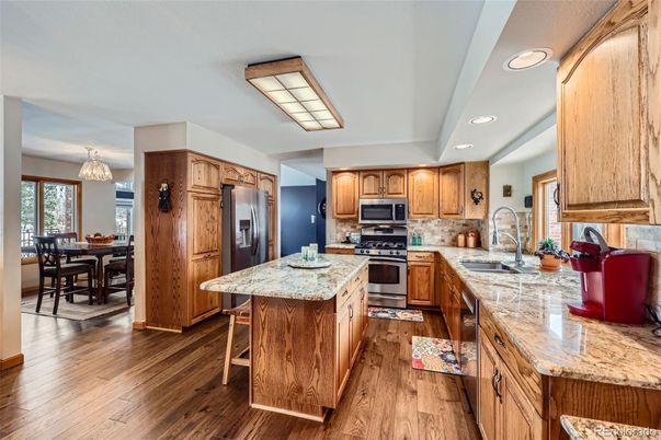 Chandelier, Dining room, Interior, Kitchen, Recessed Lighting, Stainless Steel Appliances, Wood Texture Flooring