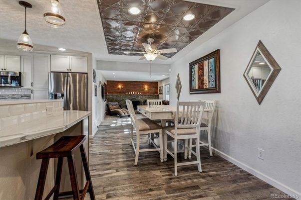 Dining room, Interior, Kitchen, Pendant Lights, Recessed Lighting, Stainless Steel Appliances, Stone Walls, Wood Texture Flooring