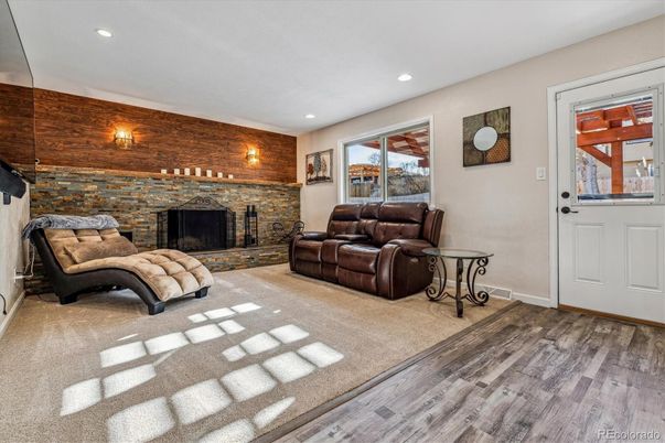 Fireplace, Interior, Living room, Recessed Lighting, Stone Walls, Wood Texture Flooring
