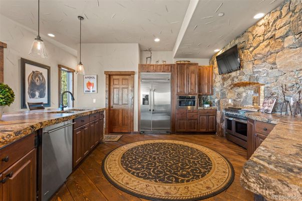Interior, Kitchen, Pendant Lights, Recessed Lighting, Stainless Steel Appliances, Stone Walls, Wood Texture Flooring