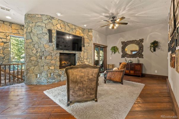 Fireplace, Interior, Recessed Lighting, Stone Walls, Wood Texture Flooring
