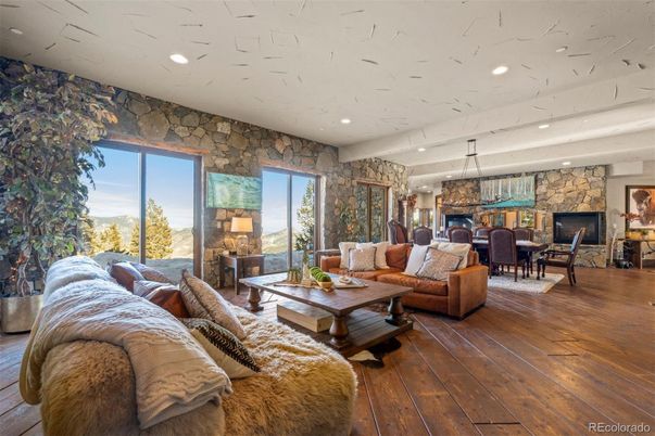 Chandelier, Dining room, Interior, Living room, Recessed Lighting, Stone Walls, Wood Texture Flooring