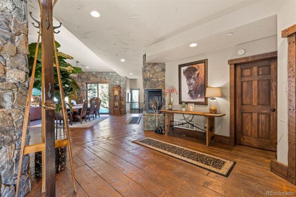 Dining room, Fireplace, Interior, Recessed Lighting, Stone Walls, Wood Texture Flooring