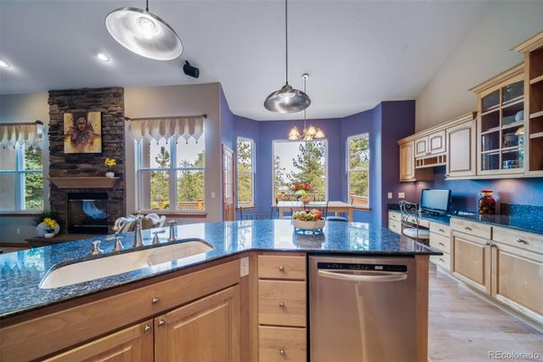 Fireplace, Interior, Kitchen, Pendant Lights, Recessed Lighting, Stone Walls, Wood Texture Flooring