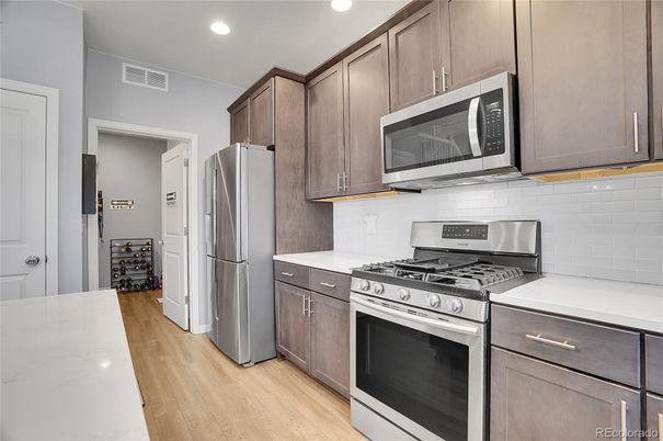 Interior, Kitchen, Recessed Lighting, Stainless Steel Appliances, Wood Texture Flooring