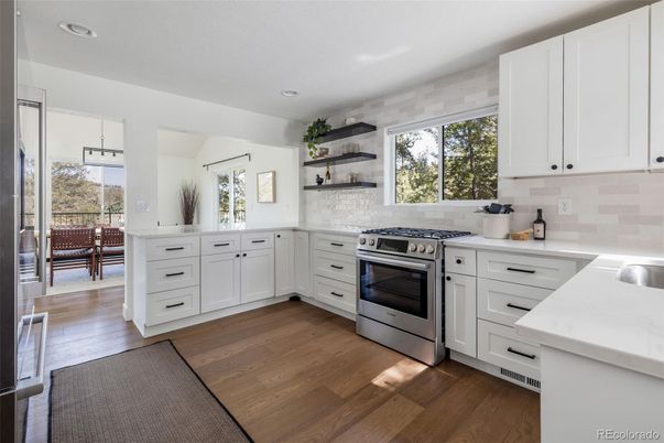 Dining room, Interior, Kitchen, Recessed Lighting, Stainless Steel Appliances, Wood Texture Flooring
