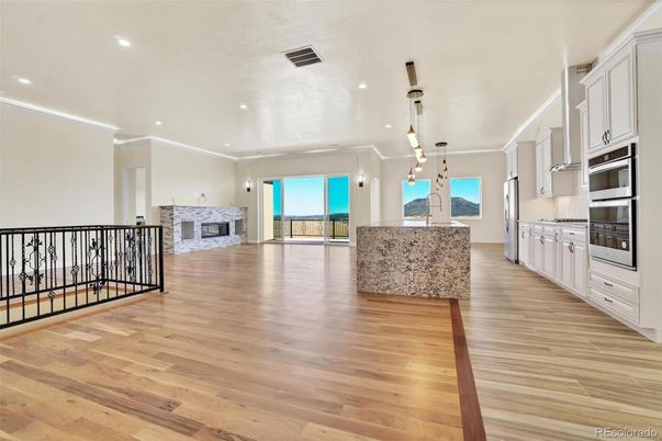 Fireplace, Interior, Kitchen, Pendant Lights, Recessed Lighting, Stainless Steel Appliances, Wood Texture Flooring