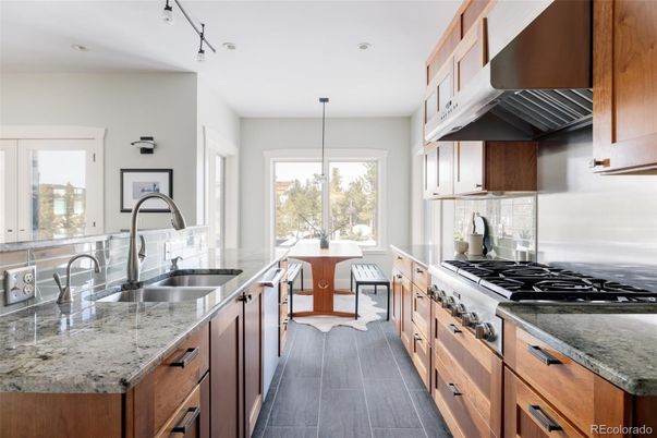 Dining room, Interior, Kitchen, Recessed Lighting, Stainless Steel Appliances, Wood Texture Flooring
