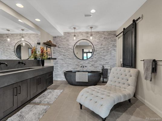Bathroom, Dual Sink Vanities, Free Standing Baths, Interior, Pendant Lights, Recessed Lighting, Stone Walls