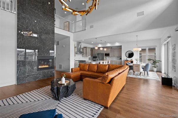 Dining room, Fireplace, Interior, Kitchen, Living room, Marble Walls, Pendant Lights, Recessed Lighting, Wood Texture Flooring
