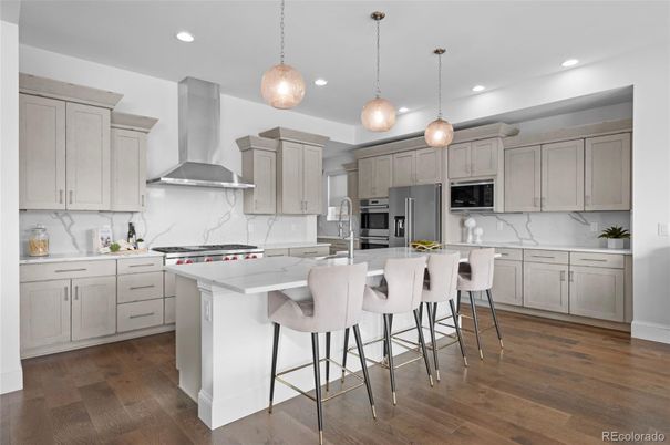 Interior, Kitchen, Marble Walls, Pendant Lights, Recessed Lighting, Stainless Steel Appliances, Wood Texture Flooring