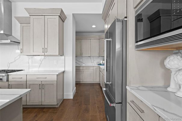 Interior, Kitchen, Marble Walls, Recessed Lighting, Stainless Steel Appliances, Wood Texture Flooring