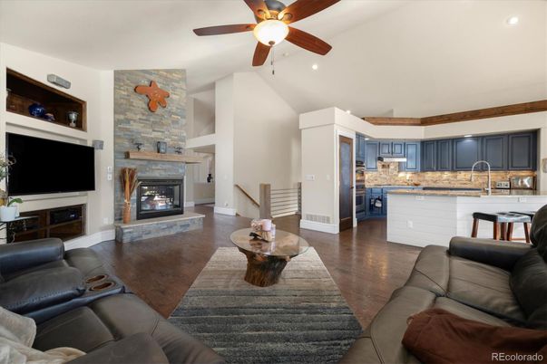 Fireplace, Interior, Kitchen, Living room, Recessed Lighting, Stone Walls, Wood Texture Flooring