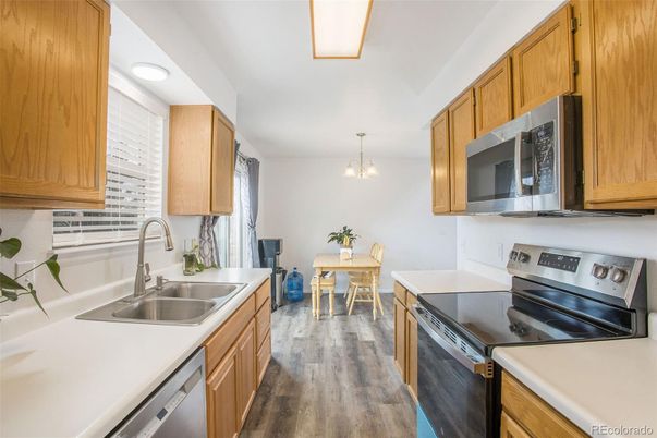 Dining room, Interior, Kitchen, Pendant Lights, Stainless Steel Appliances, Wood Texture Flooring