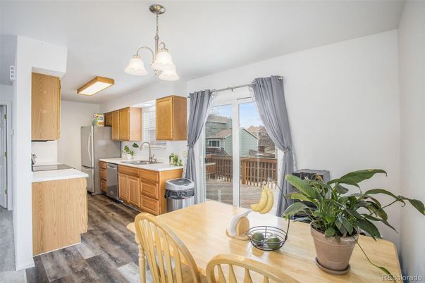Chandelier, Dining room, Interior, Kitchen, Pendant Lights, Stainless Steel Appliances, Wood Texture Flooring