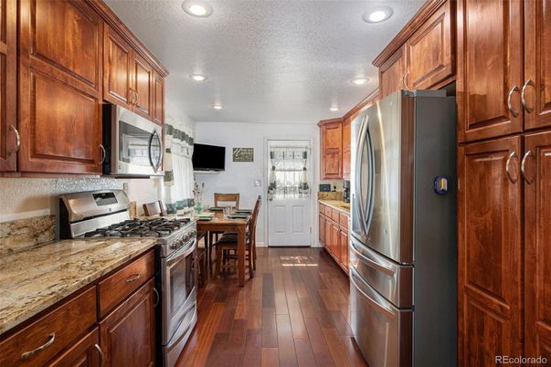 Dining room, Interior, Kitchen, Recessed Lighting, Stainless Steel Appliances, Wood Texture Flooring