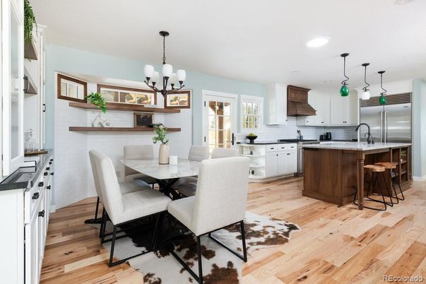 Chandelier, Dining room, Interior, Kitchen, Pendant Lights, Recessed Lighting, Stainless Steel Appliances, Wood Texture Flooring