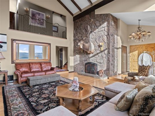 Chandelier, Fireplace, Interior, Living room, Stone Walls, Wood Texture Flooring
