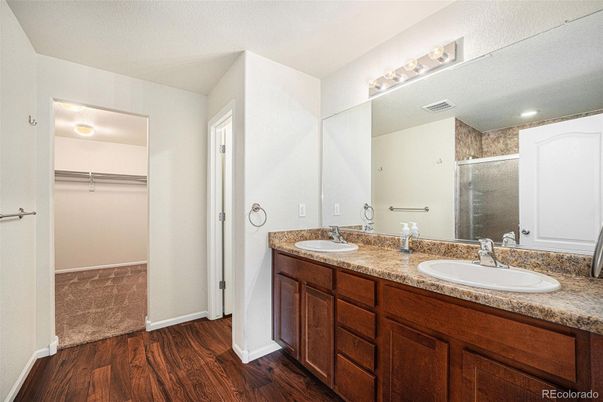 Bathroom, Dual Sink Vanities, Interior, Recessed Lighting, Walk-in Closets, Wood Texture Flooring